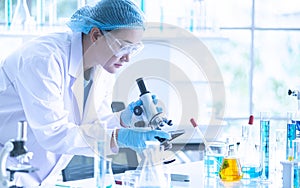 Asian woman scientist, researcher, technician, or student conducted research in laboratory photo