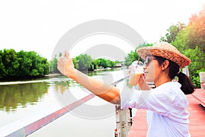 Asian woman selfie with glass of ice coffee, Travel and Lifestyle