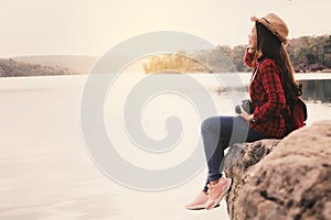 Asian woman shooting picture in nature