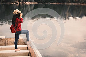 Asian woman shooting picture in nature