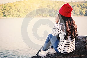 Asian woman shooting picture in nature