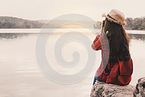 Asian woman shooting picture in nature