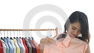 Asian woman shopping new clothes, choosing and trying on a new clothe