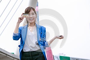 Asian woman shopping smile and holding credit card and shopping