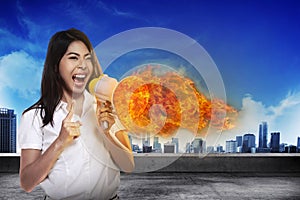Asian Woman Shouting Megaphone On Fire