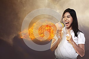 Asian Woman Shouting Megaphone On Fire