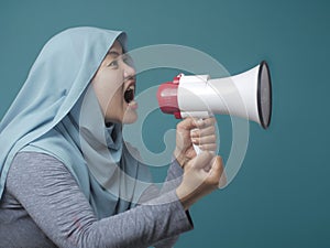 Asian woman Shouting with Megaphone, Side View