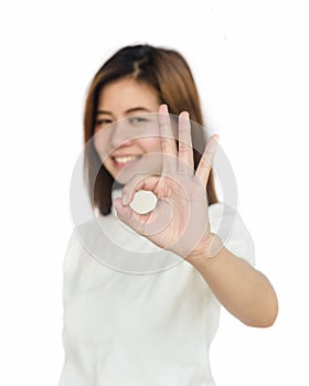 Asian woman showing hand sign .