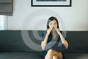 Asian woman with sinus and suffer from sinusitis,Female hand touching nose,Healthy and nasal allergic