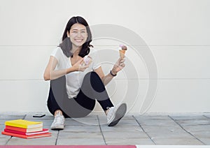 Asian woman sit and relax with ice cream