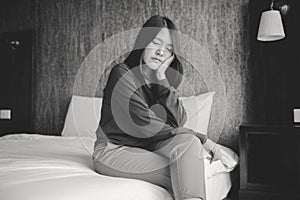 Asian woman sitting and feeling depressed or lonely have a headache in bedroom,Mental disorder health care,World suicide preventio