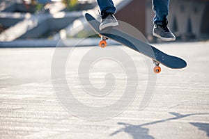 Asian woman skateboarder skateboarding