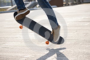 Asian woman skateboarder skateboarding