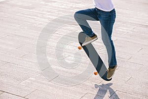 Asian woman skateboarder skateboarding