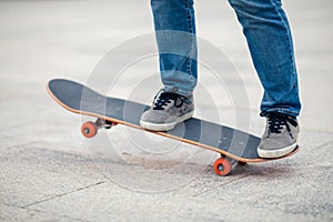 Asian woman skateboarder skateboarding