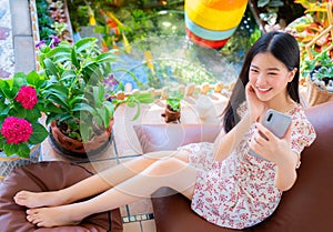 Asian woman sleep and relax with coffee cup on hand