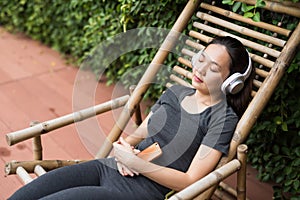 woman listen online music in park after running