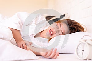 Asian woman sleeping on the bed and grinding teeth,Female bruxism