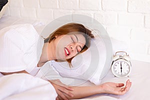 Asian woman sleeping on the bed and grinding teeth,Female bruxism photo