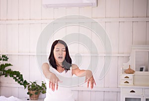 Asian woman sleepwalker with  somnambulism sleep and walking in bedroom photo