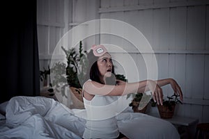 Asian woman sleepwalker with somnambulism sleep and walking in bedroom at night photo