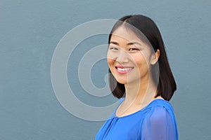 Asian woman smiling and laughing with copy space