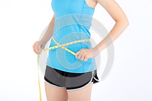 Asian woman in sport clothes and body slim with measuring waist