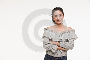 Asian woman standing and crossed her arms