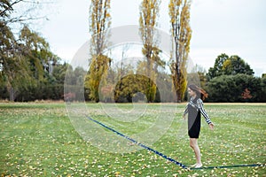 Asian female in autumn nature with dressing, football playground