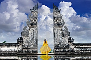 Asian woman standing at Lempuyang Luhur temple in Bali, Indonesia