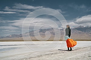 Asian woman standing on saline alkali land