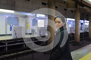 Asian woman in station