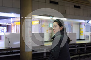 Asian woman in station