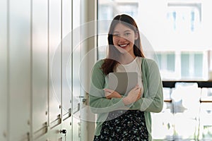 Asian woman student with tablet with locker at school. E-learning ,online ,education concpet.