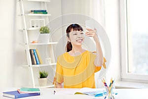 Asian woman student taking selfie with smartphone