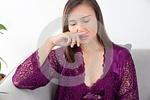 Asian woman stuffy nose.