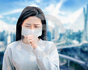 Asian  woman suffer from cough with face mask protection