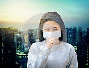 Asian  woman suffer from cough with face mask protection