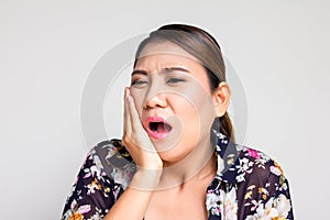 Asian woman suffering from toothache