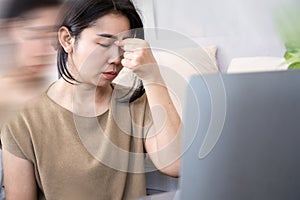 Asian woman suffering from vertigo, dizziness , inner ear health problem or high blood pressure photo