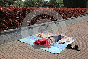 An Asian woman sunbathes in the sun.