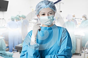 Asian woman surgeon in operation room