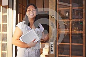 Asian woman, tablet and door of restaurant to welcome service, small business owner or hostess. Manager at entrance
