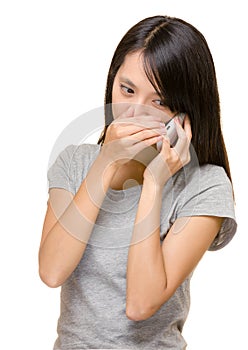 Asian woman talking phone secretly photo
