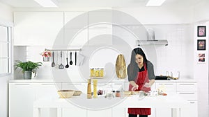 Asian woman teaching daughterkitchen