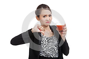 Asian woman thumbs down hate tomato juice