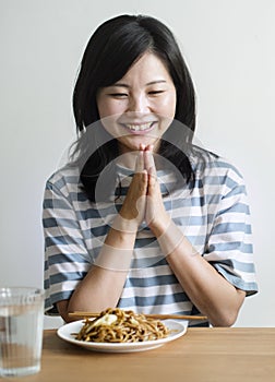 Asian woman about to eat noodles photo