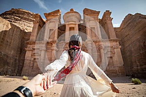 Asian woman tourist holding hand in Petra, Jordan