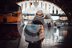 Asian woman tourist traveller backpack to train station. at Hua Lamphong Station Bangkok Thailand