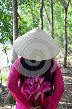 Asian woman in traditional dress with flowers